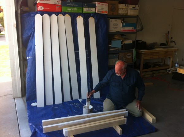 Pop paints the slats.