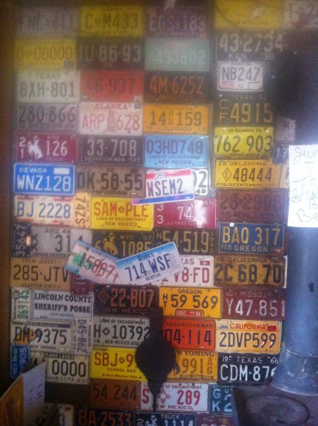 License plate covered wall in the old saloon hall.
