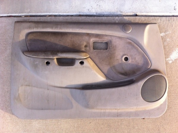 Driver's side door panel removed.  14 years of dirt and gunk. Messy.