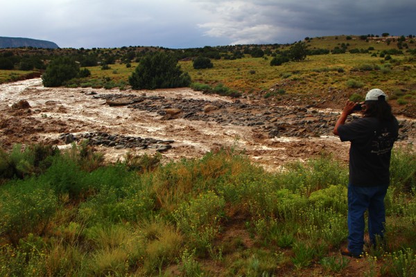 This gent and I had the same idea as we drove over a bridge on 64 after the storm passed through.  We both saw the water, parked on the shoulder beyond the bridge, and hopped out to get a few photos of the swollen creek bed where rushing runoff ran.