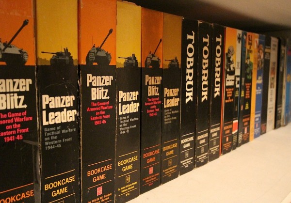 Wide-angle lens practice on a shelf of old Avalon Hill games.