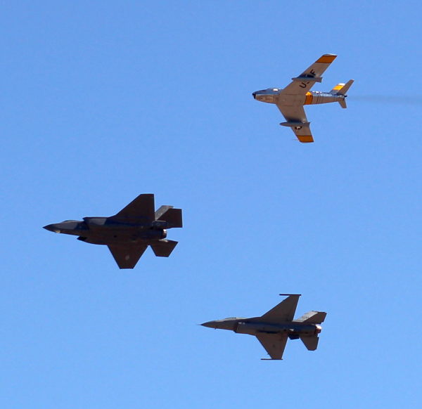 An F-86 Sabre, F-22 Raptor, and F-16 Falcon roam the morning skies above the PIMA museum.