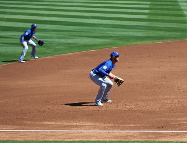 Addison Russell and Kris Bryant react to a pitch.