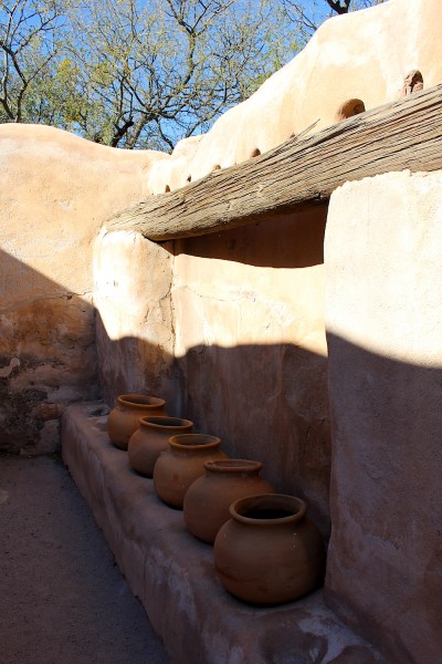 Pots on a storehouse wall.