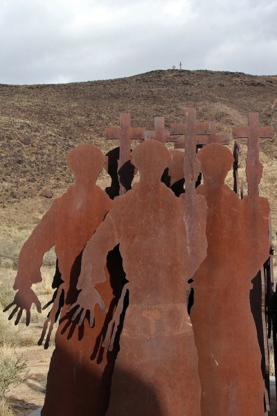 Spanish priests face the calvario in Armando Alvarez's sculpture "La Puerta del Sol".